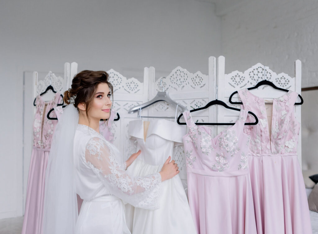 bride with white dress and bridesmaid dresses