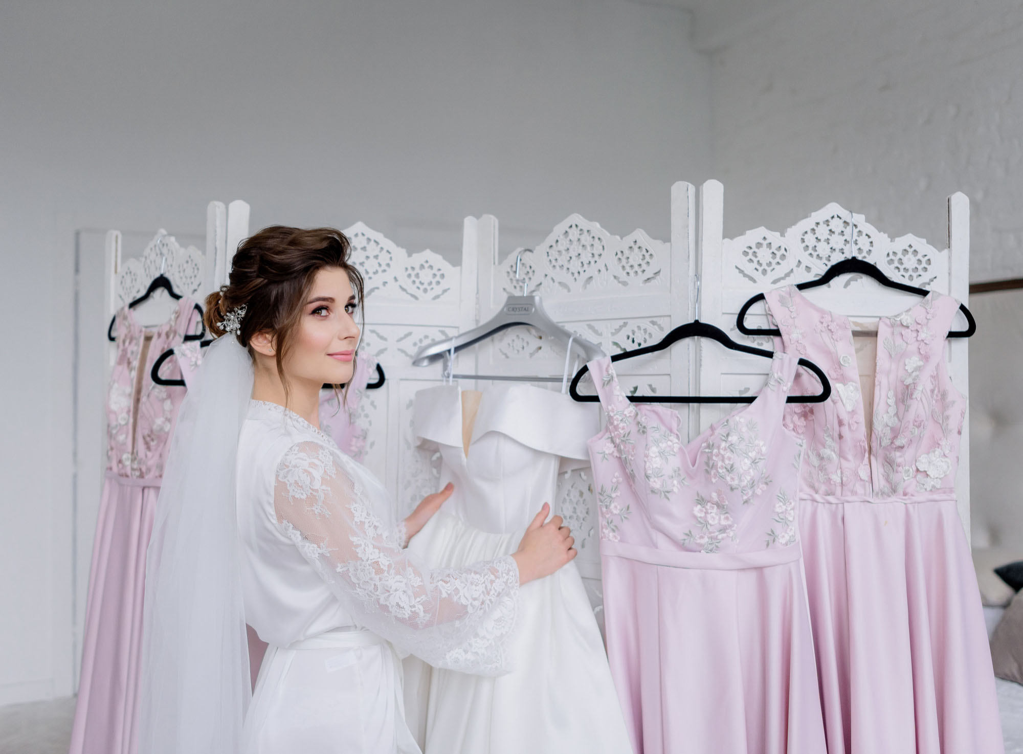 bride with white dress and bridesmaid dresses
