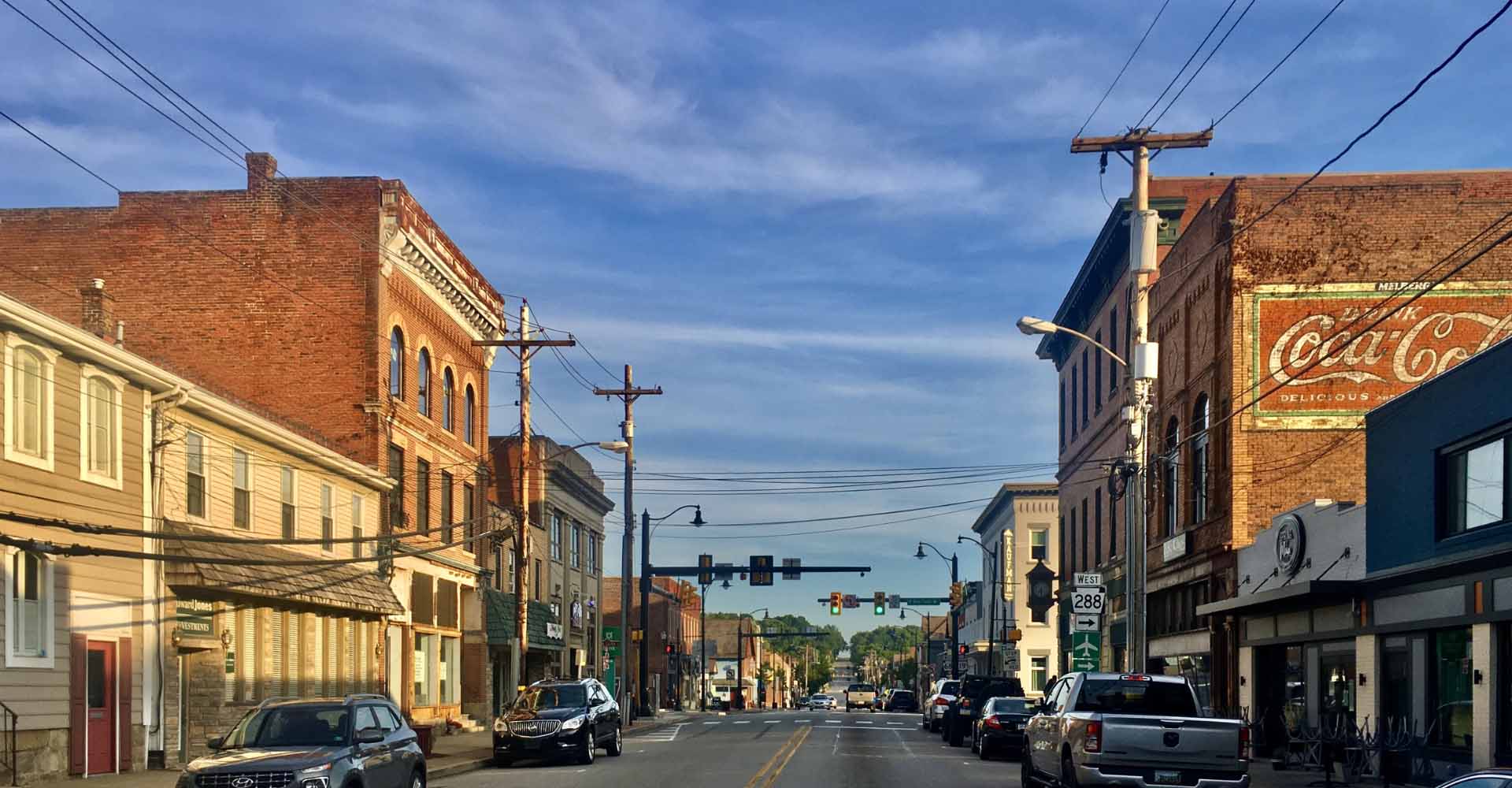 busy street brick buildings cars